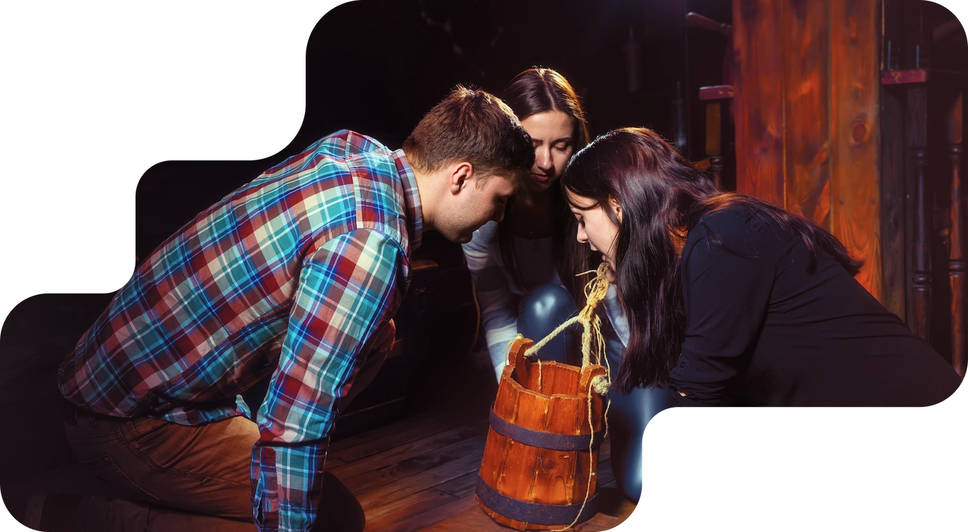 Group solving a puzzle in an escape room, booking system for escape games and laser tag