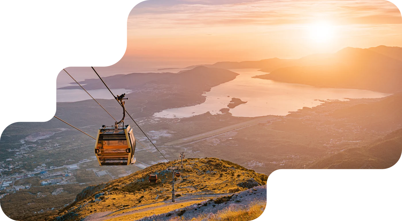 Mountain panorama above a misty valley, booking system for lifts and cable cars