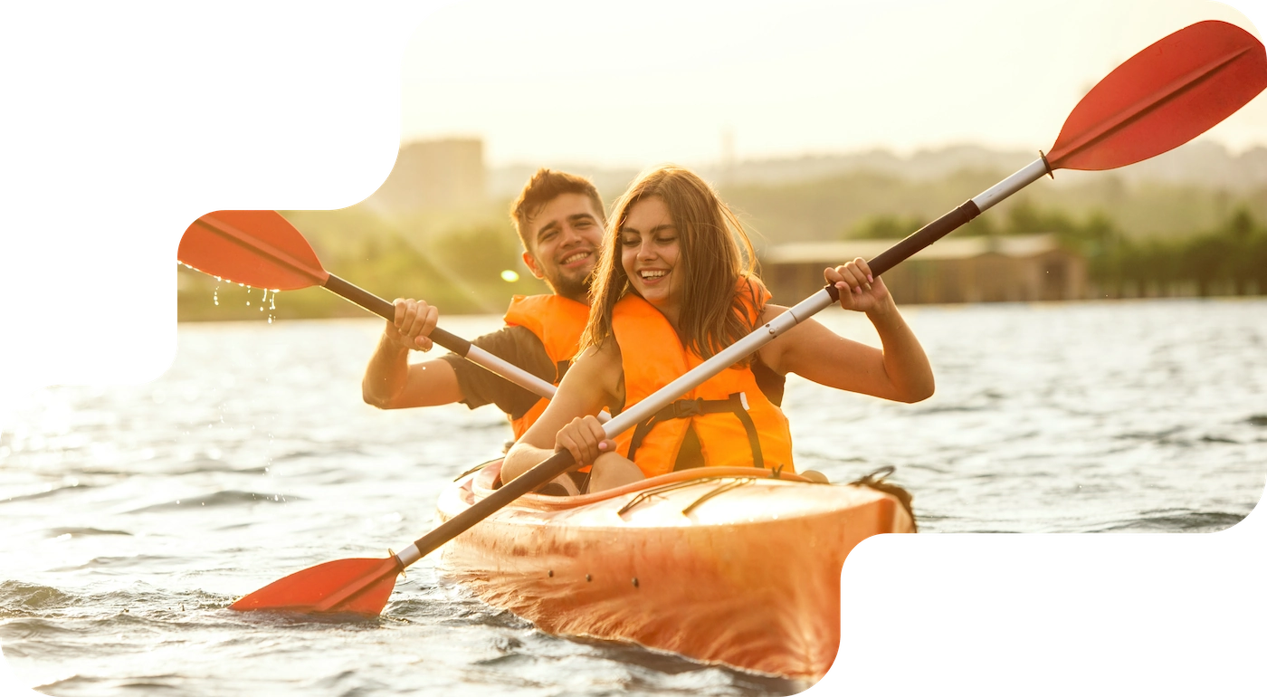 Couple in a tandem kayak on a lake, booking system for rentals and hire